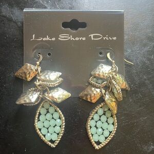 Light green with gold tone dangling earrings.